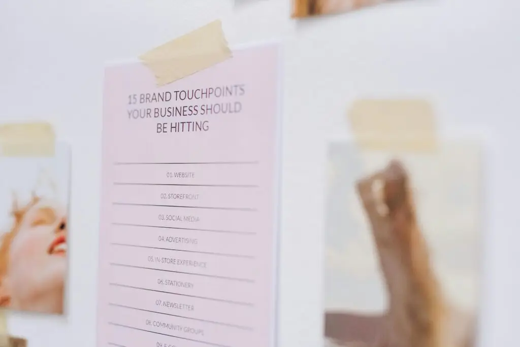 Close-up of a wall displaying a list of brand touchpoints for businesses.